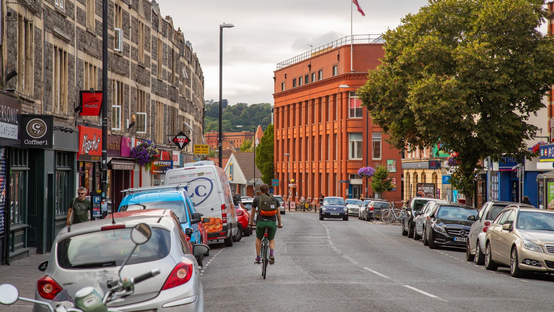 Colourful shops and cyclist on a Bristol high street